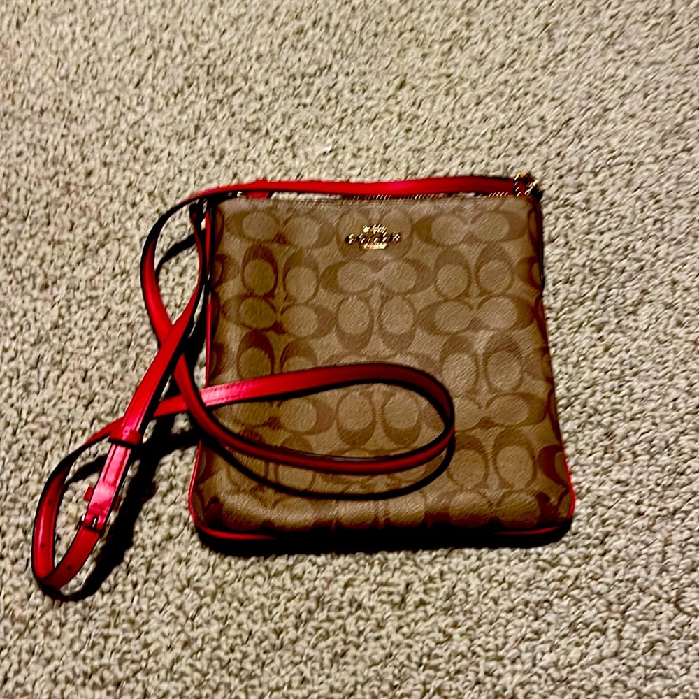 Coach cross body purse with hot pink strap and piping. Excellent condition